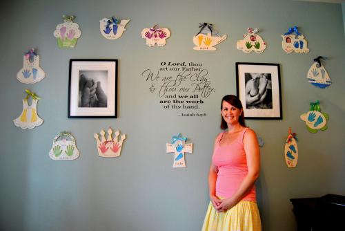 The Beautiful Jamie LeVine standing in front of her main display wall. She  has a huge heart to match her amazing talent. 